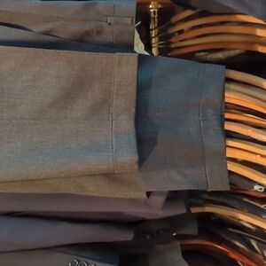 Tommy Hilfiger grey dress pants size 42 waist 30.5 inseam. With cuffs. Pleated